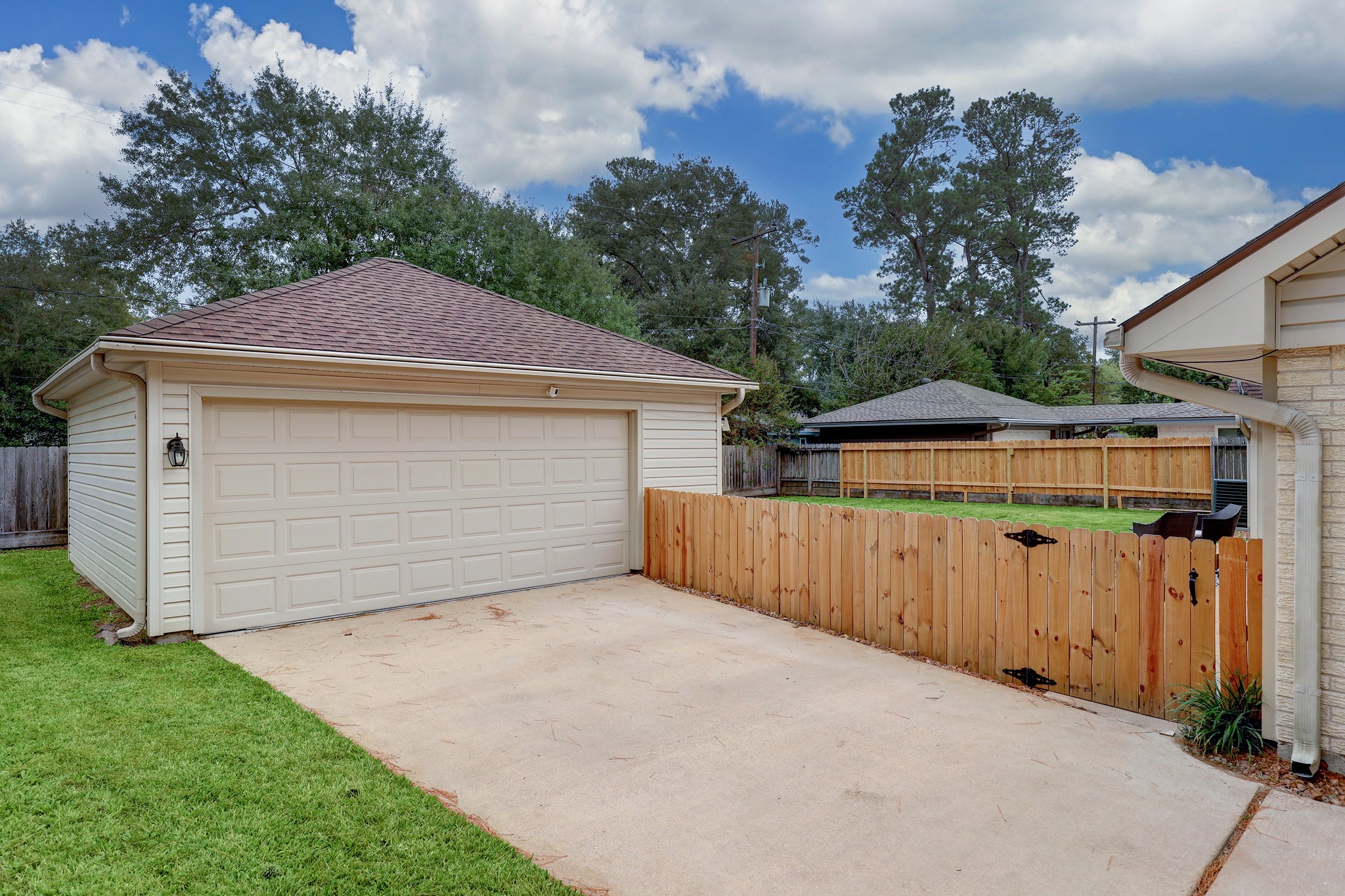 1810 Nocturne Lane Houston, TX 77043 - Photo 31 of 32 a front view of a house with a garage and yard