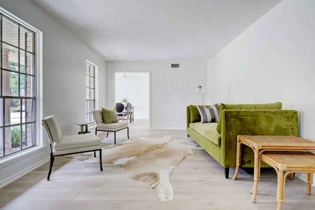 a living room with furniture and a rug