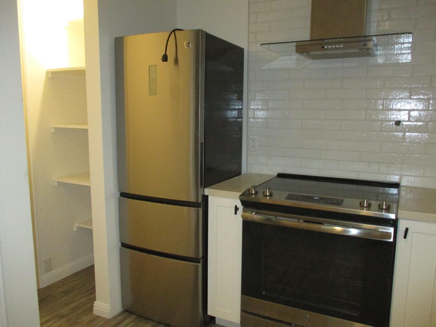 1160 3rd Street, Unit B Gilroy, CA 95020 - Photo 4 of 12 a view of a refrigerator in kitchen