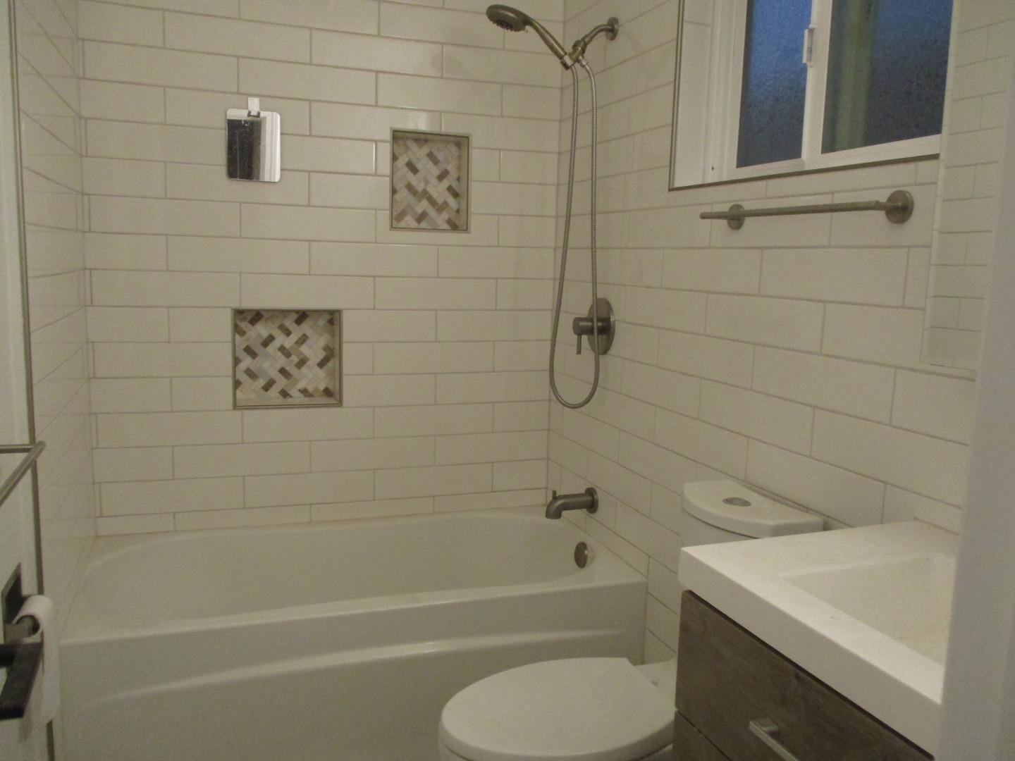 1160 3rd Street, Unit B Gilroy, CA 95020 - Photo 7 of 12 a bathroom with a toilet and a bath tub