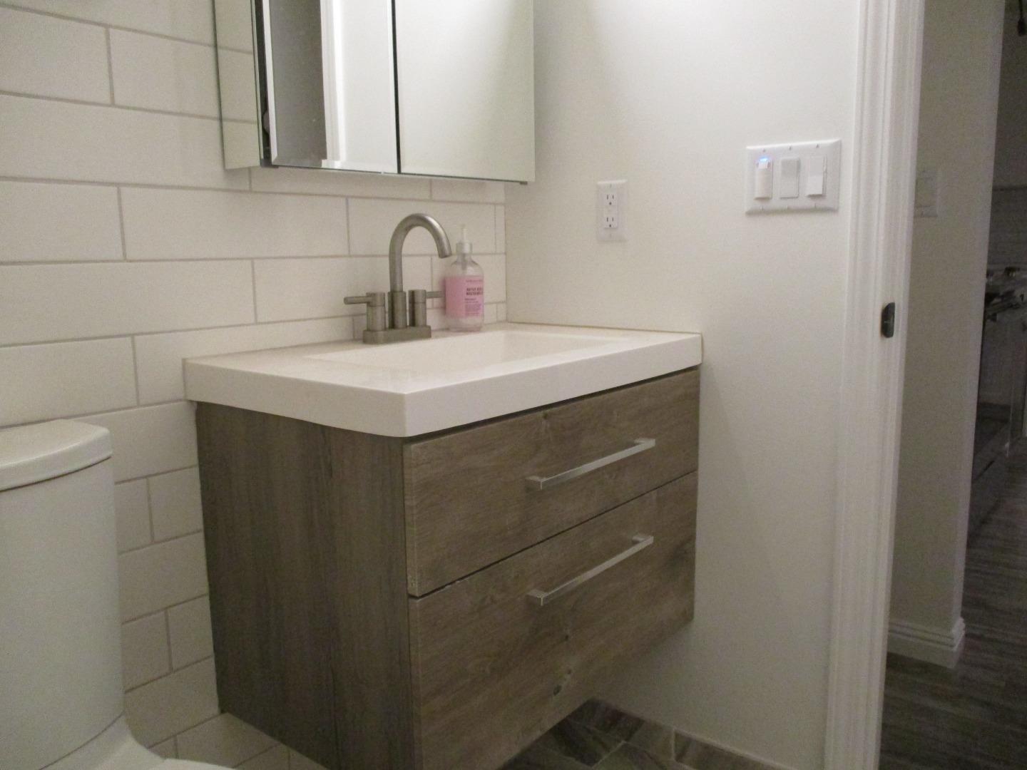 1160 3rd Street, Unit B Gilroy, CA 95020 - Photo 8 of 12 a bathroom with a sink and a toilet