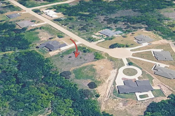 an aerial view of a house with outdoor space