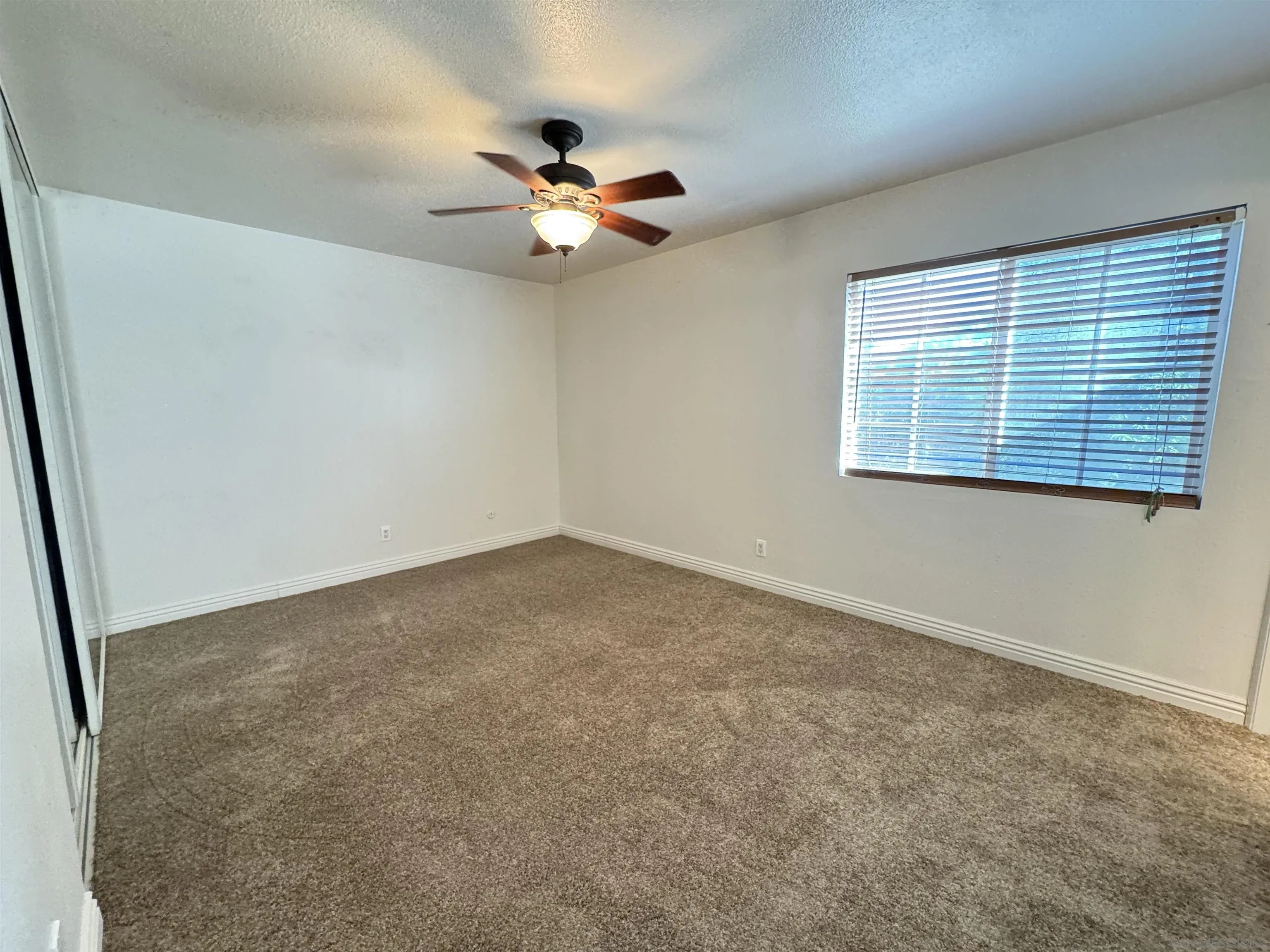 1531 View Pointe Avenue Escondido, CA 92027 - Photo 17 of 41 a view of an empty room with a window