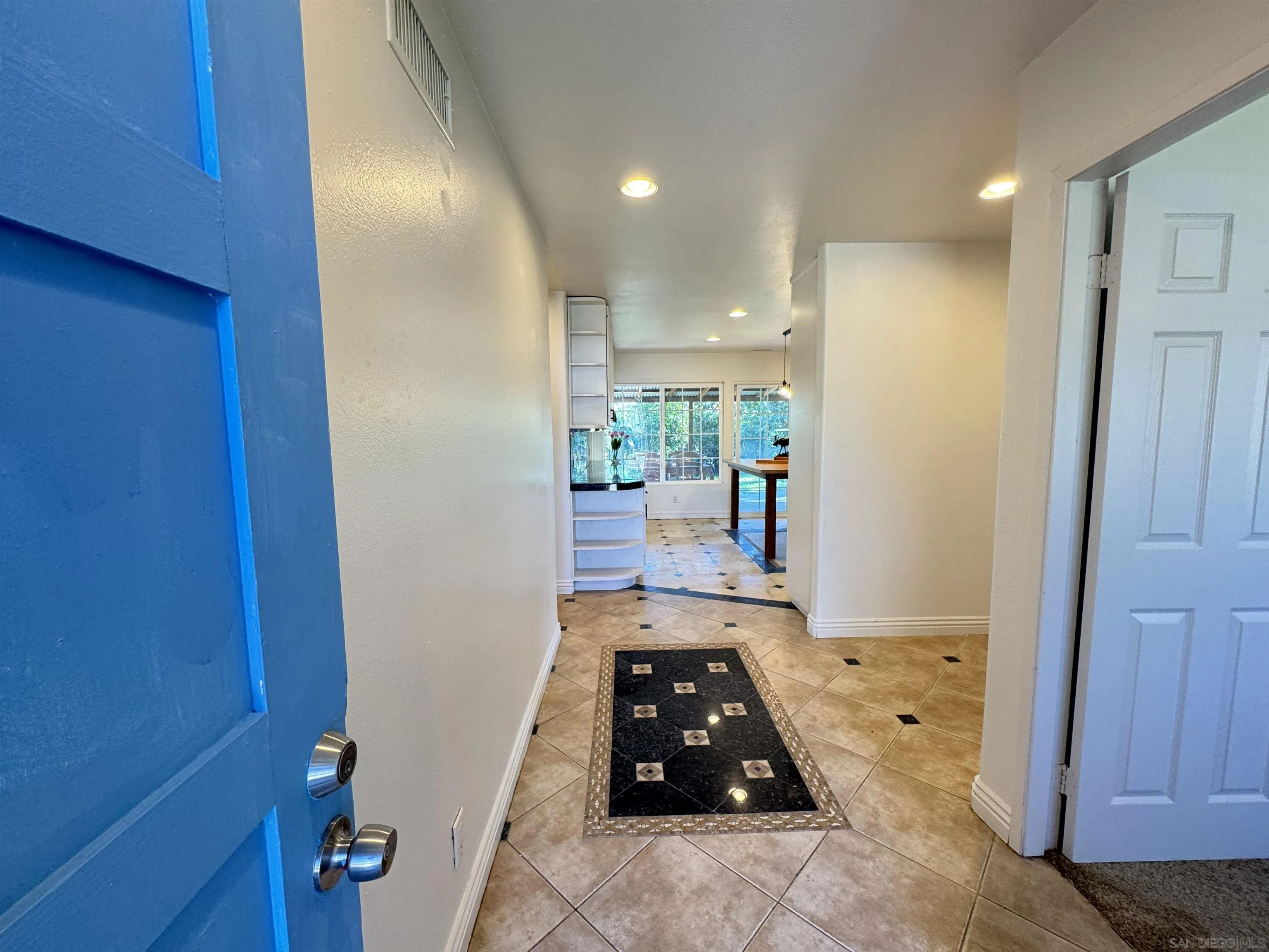 1531 View Pointe Avenue Escondido, CA 92027 - Photo 2 of 41 a view of a hallway to room with wooden floor and a livingroom view