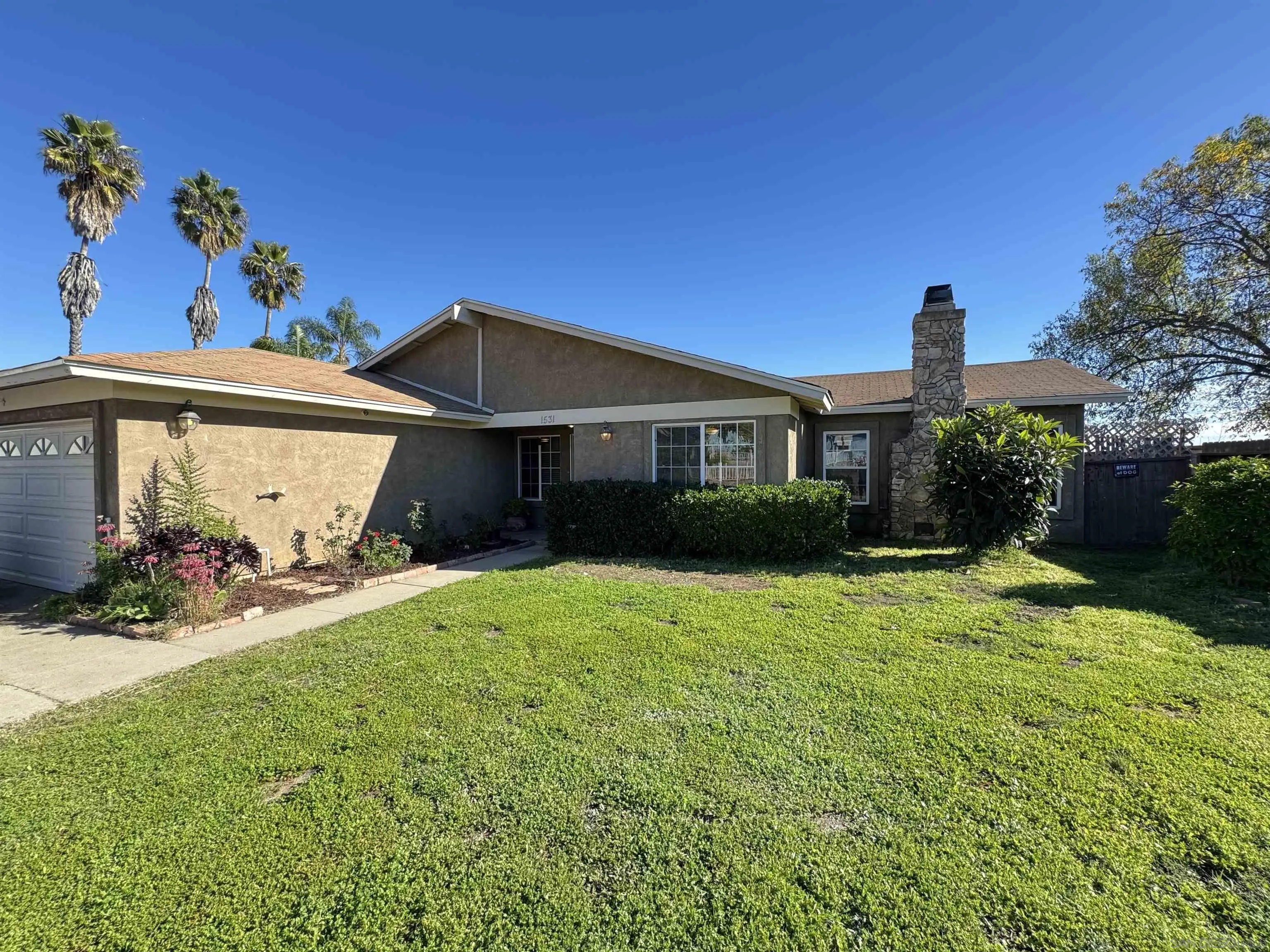 1531 View Pointe Avenue Escondido, CA 92027 - Photo 27 of 41 a front view of a house with a yard and garage