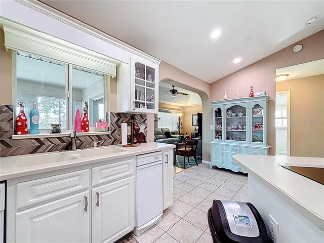 a bathroom with a granite countertop sink mirror and toilet