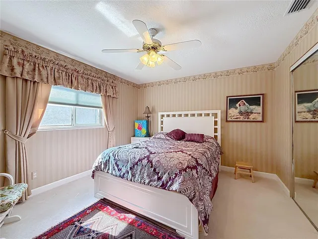 a utility room with cabinets washer and dryer