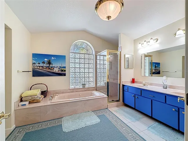 a front view of house with outdoor seating and plants