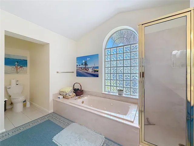 a view of a swimming pool and lounge chairs