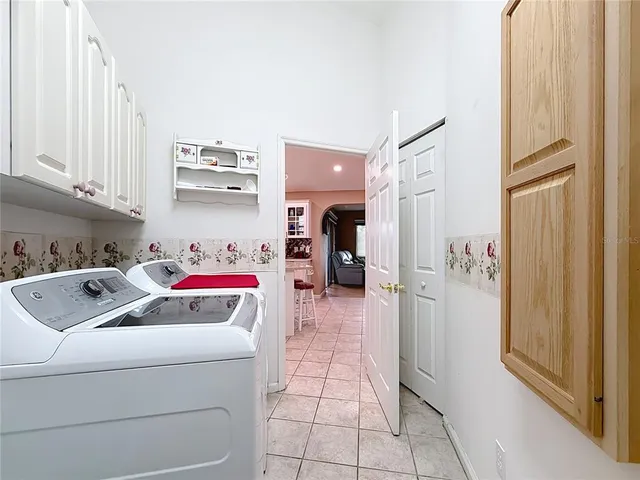 a front view of a house with a garden and plants