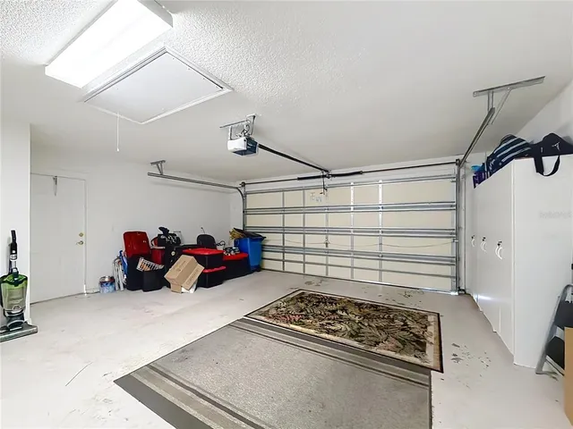 an aerial view of residential houses with outdoor space and swimming pool