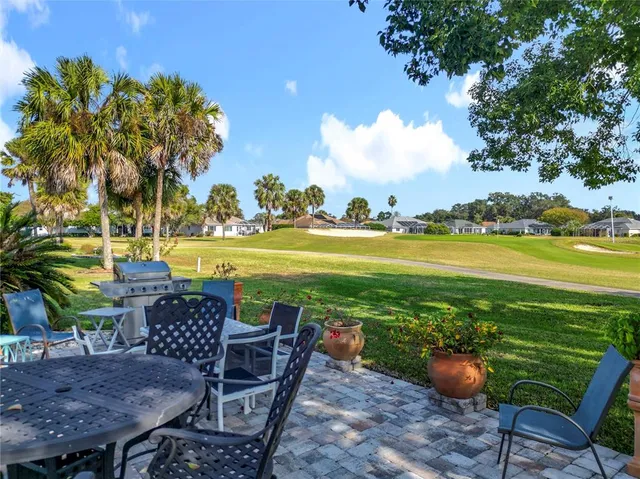 an aerial view of residential houses with outdoor space and swimming pool