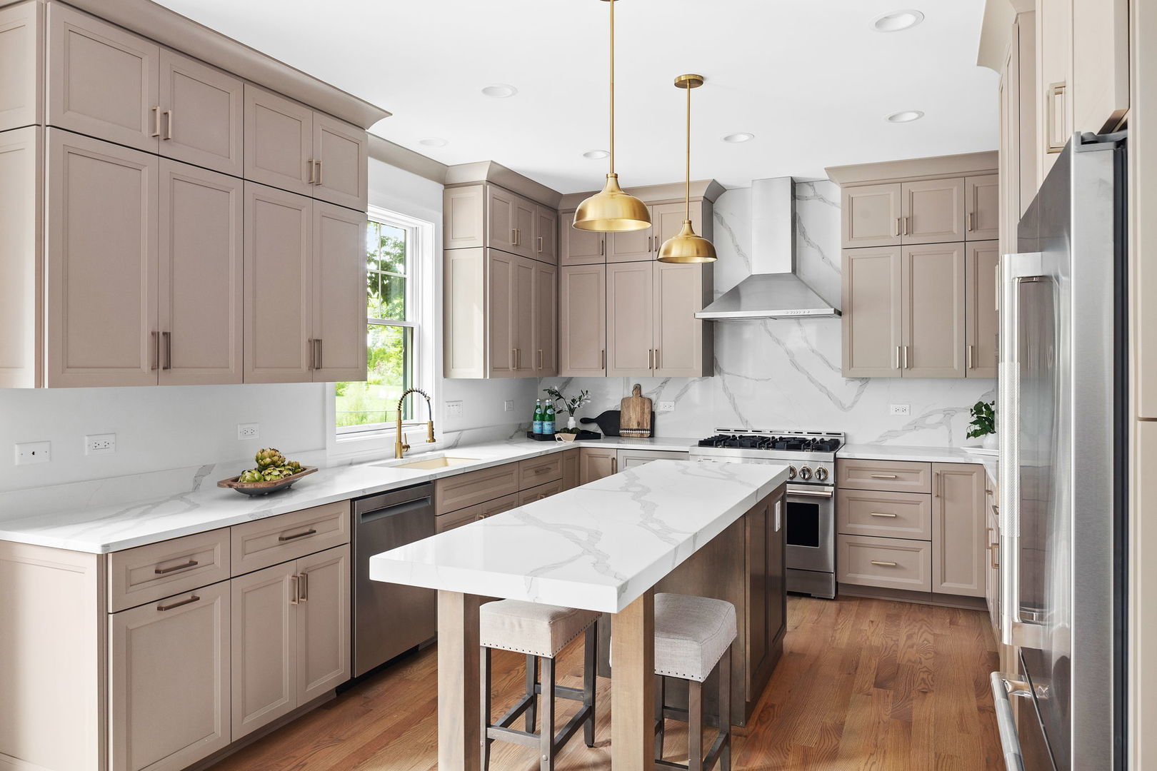 110 South Lorraine Road Wheaton, IL 60187 - Photo 12 of 40 a kitchen with a sink stove and white cabinets