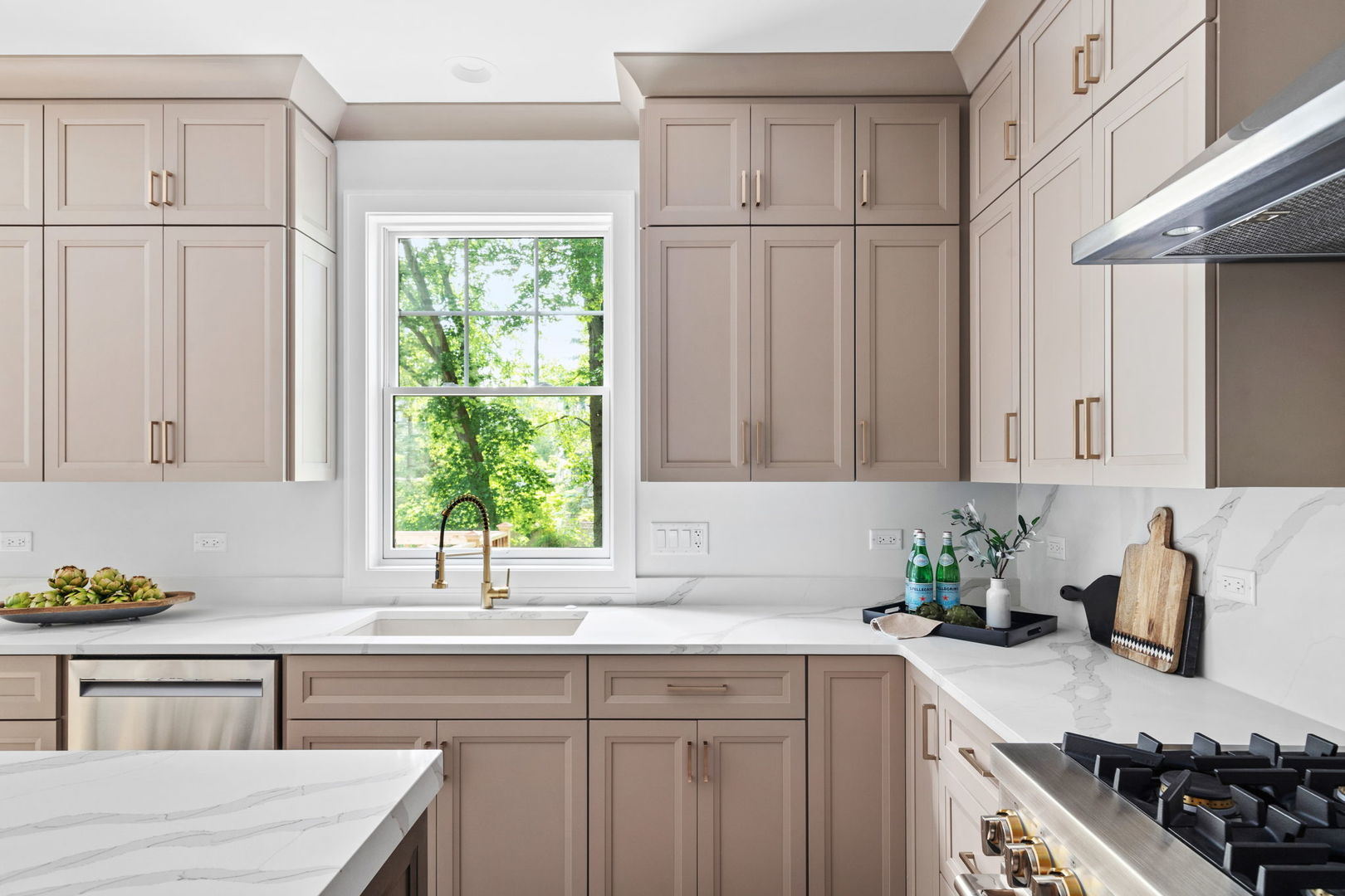 110 South Lorraine Road Wheaton, IL 60187 - Photo 13 of 40 a kitchen with stainless steel appliances granite countertop a sink stove and cabinets