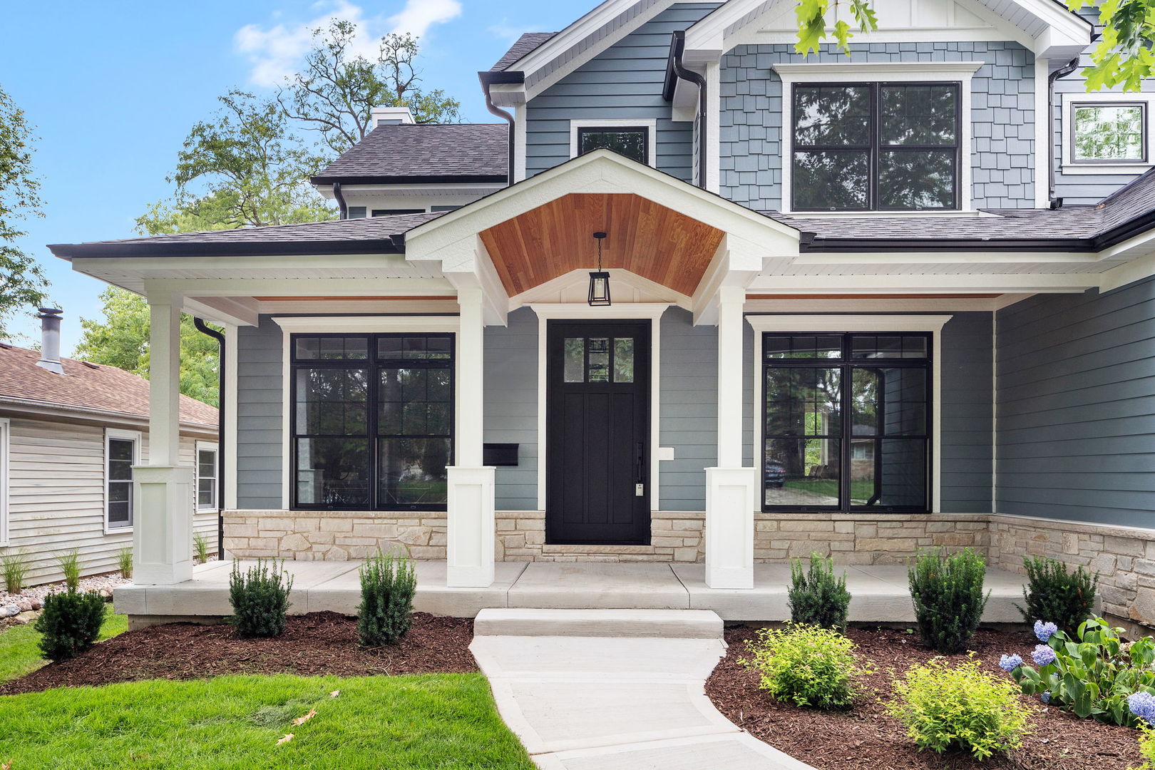 110 South Lorraine Road Wheaton, IL 60187 - Photo 2 of 40 a front view of a house with garden