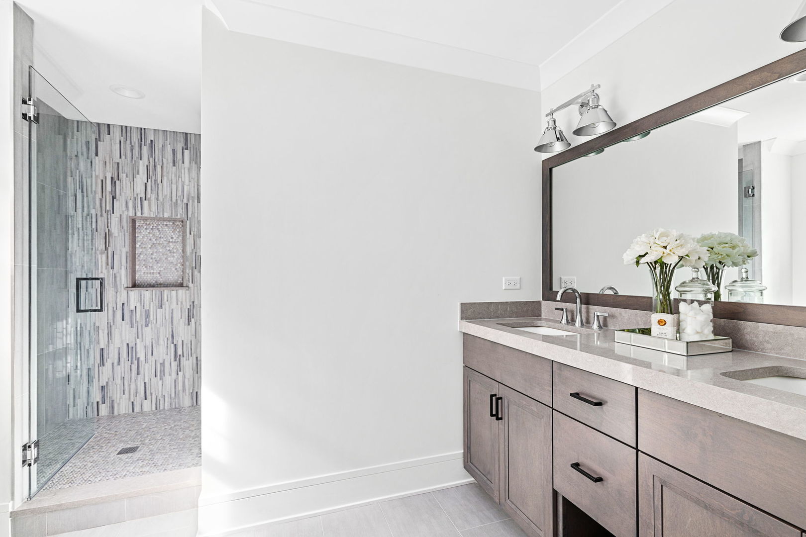 110 South Lorraine Road Wheaton, IL 60187 - Photo 22 of 40 a bathroom with a double vanity sink and mirror