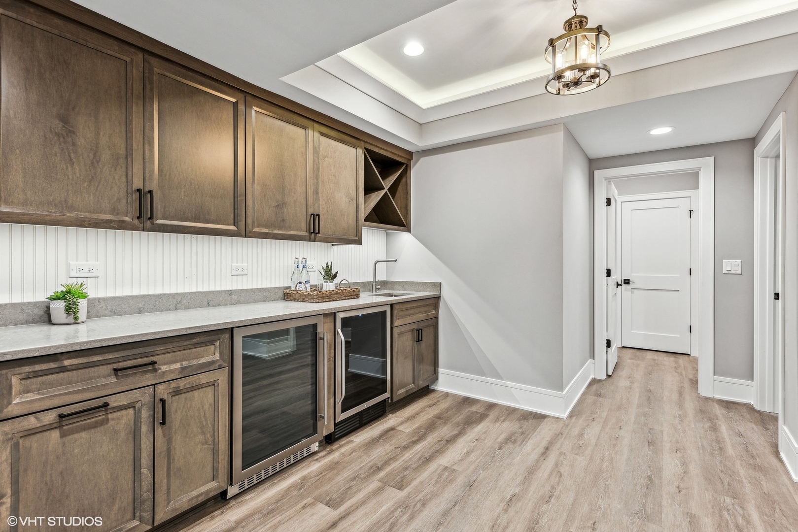 110 South Lorraine Road Wheaton, IL 60187 - Photo 25 of 40 a kitchen with stainless steel appliances granite countertop a sink cabinets and wooden floor