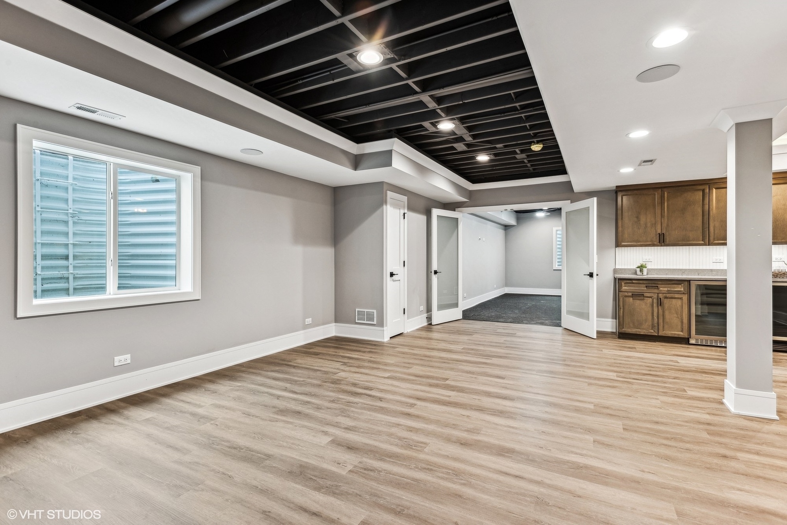 110 South Lorraine Road Wheaton, IL 60187 - Photo 27 of 40 a view of empty room with wooden floor and fireplace