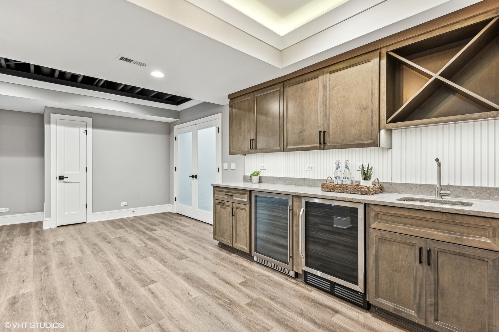 110 South Lorraine Road Wheaton, IL 60187 - Photo 32 of 40 a kitchen with stainless steel appliances granite countertop a sink and cabinets with wooden floor
