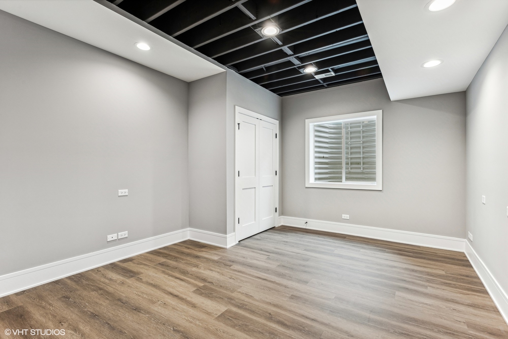 110 South Lorraine Road Wheaton, IL 60187 - Photo 33 of 40 a view of an empty room with wooden floor and a window