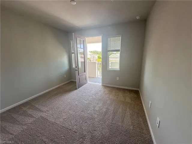 a view of a balcony with furniture