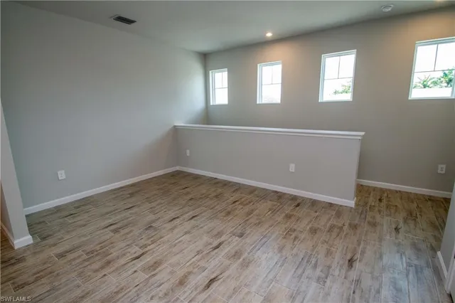 a view of a hallway with wooden shelves
