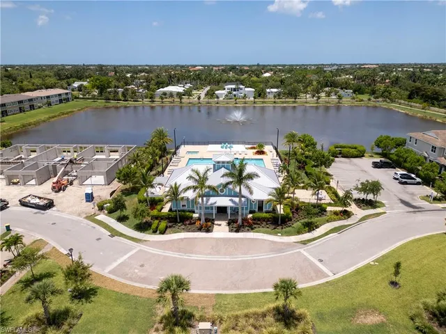 an aerial view of a house with a lake view