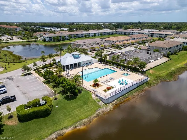 a view of a swimming pool and an outdoor seating