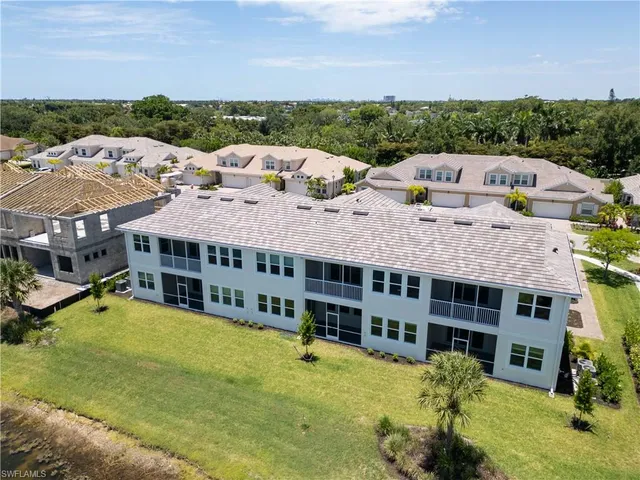 a view of a swimming pool and lounge chair
