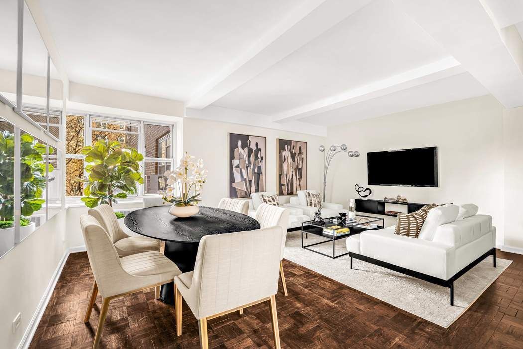 500 Grand Street, Unit C4H Manhattan, NY 10002 - Photo 3 of 11 a view of a dining room with furniture and wooden floor