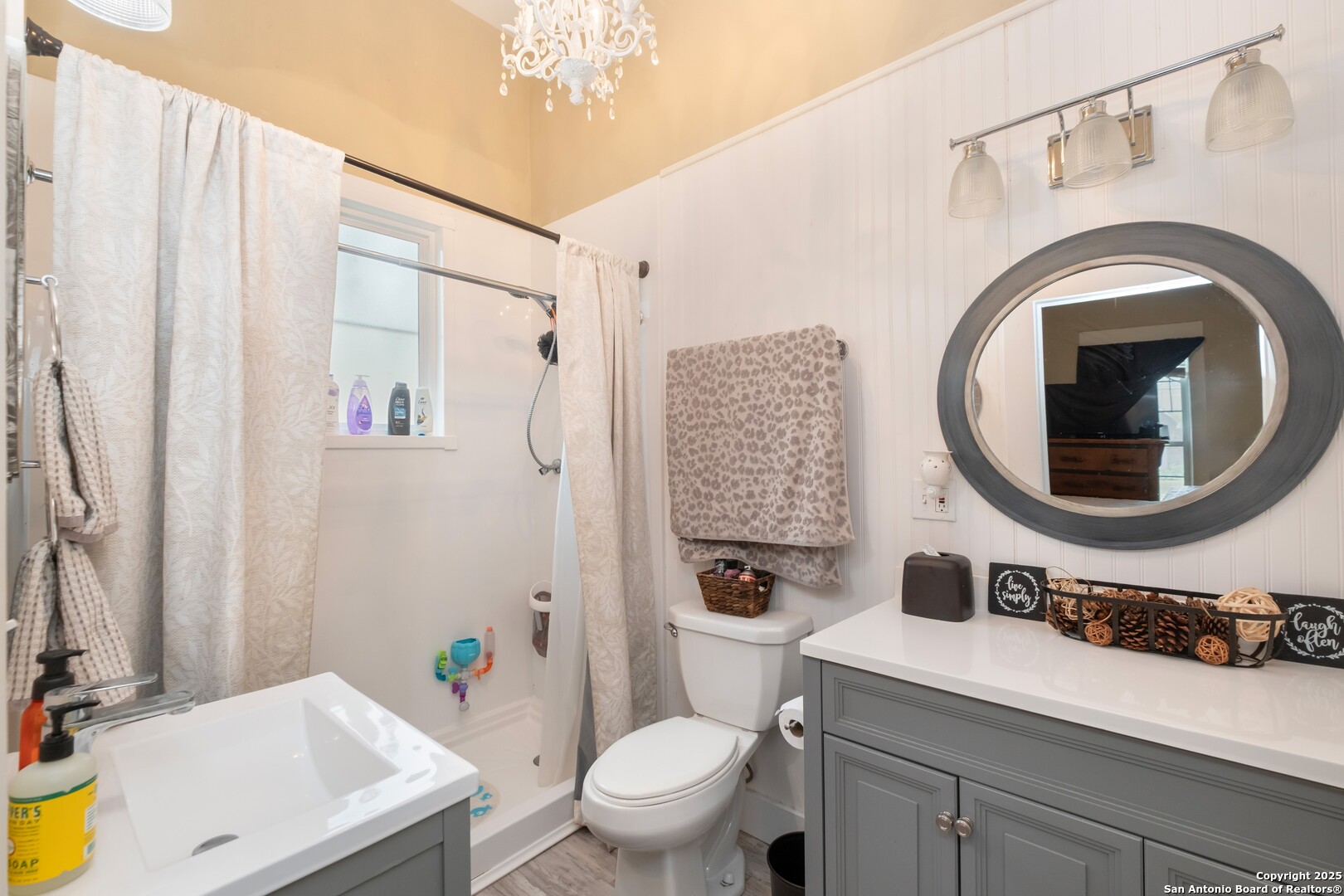 301 Jefferson Drive Devine, TX 78016 - Photo 12 of 29 a bathroom with a sink a toilet and a mirror