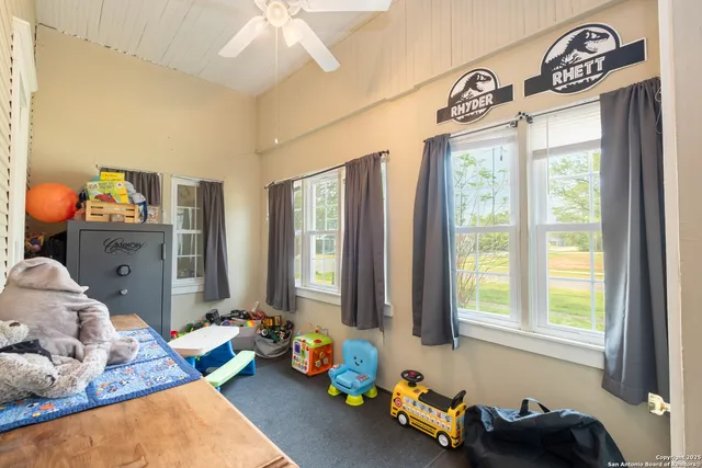 a bedroom with furniture and a window