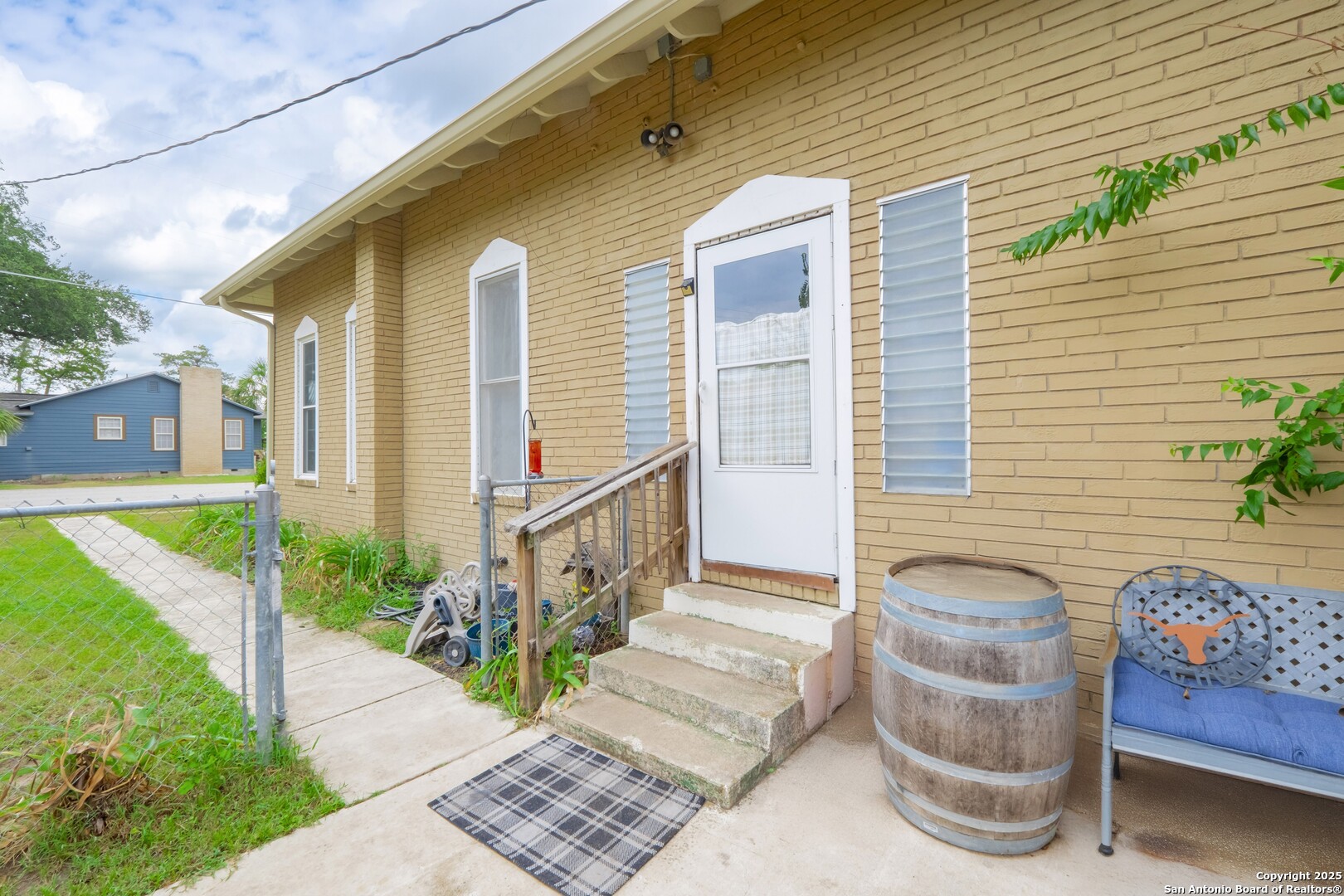 301 Jefferson Drive Devine, TX 78016 - Photo 2 of 29 a view of a house with backyard and sitting area