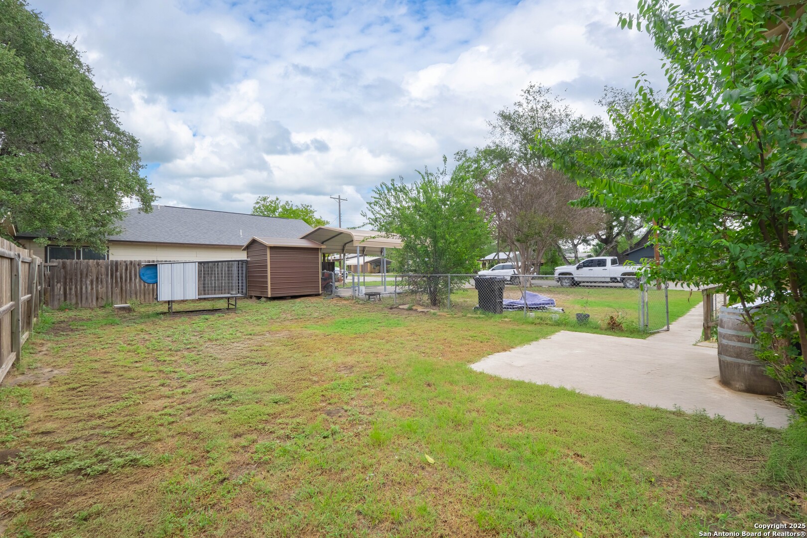 301 Jefferson Drive Devine, TX 78016 - Photo 21 of 29 a front view of a house with garden
