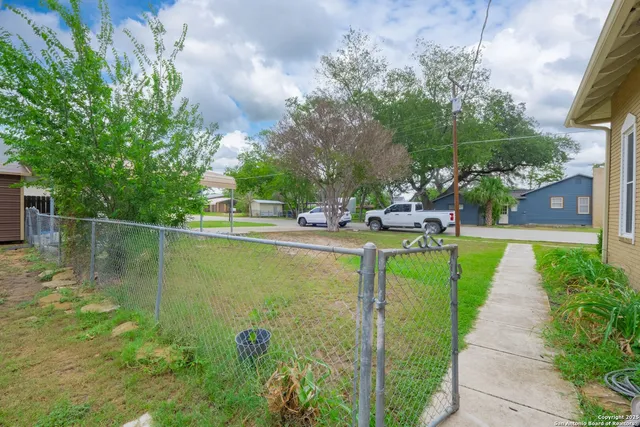a view of a garden with lawn chairs