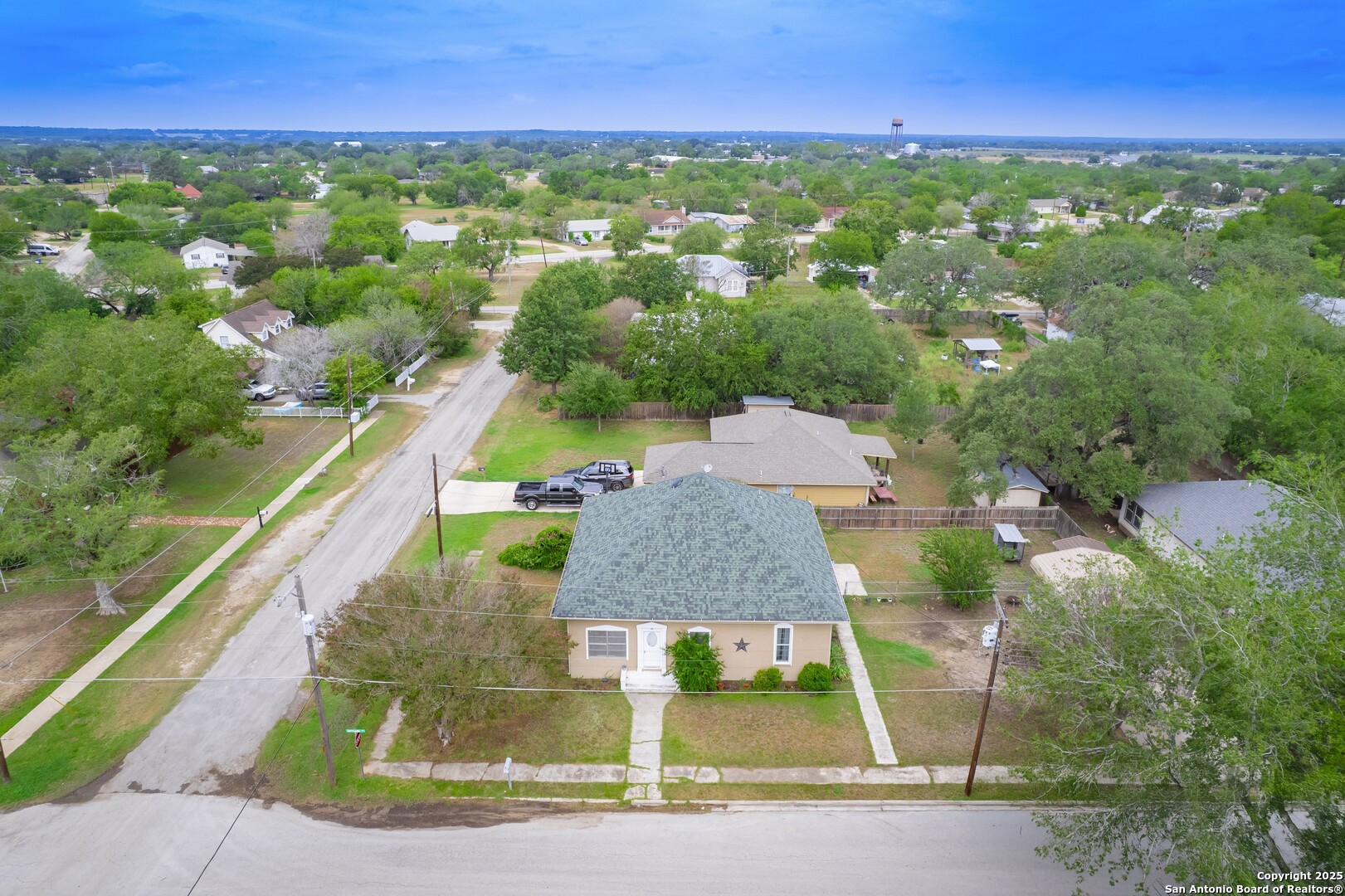 301 Jefferson Drive Devine, TX 78016 - Photo 26 of 29 an aerial view of residential houses with outdoor space and street view