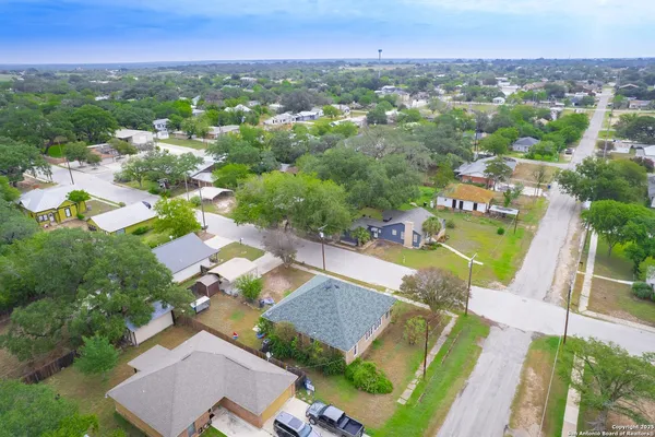 an aerial view of residential houses with outdoor space