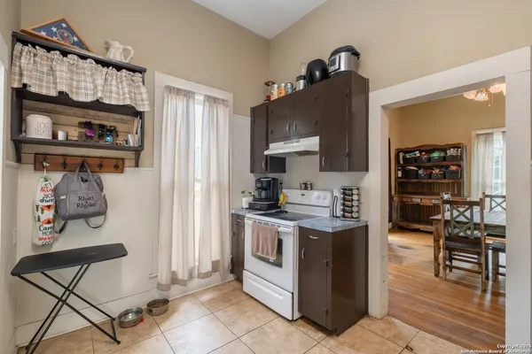 a kitchen with stainless steel appliances granite countertop a stove and a refrigerator