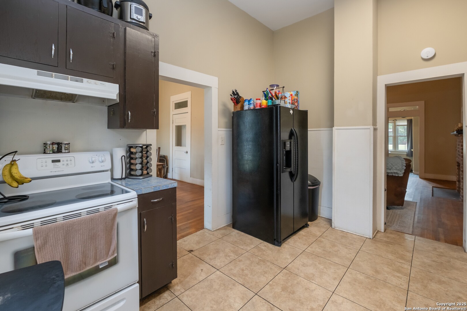 301 Jefferson Drive Devine, TX 78016 - Photo 5 of 29 a kitchen with stainless steel appliances granite countertop a refrigerator and a stove