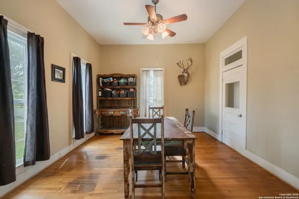 a view of a dining room with furniture and window