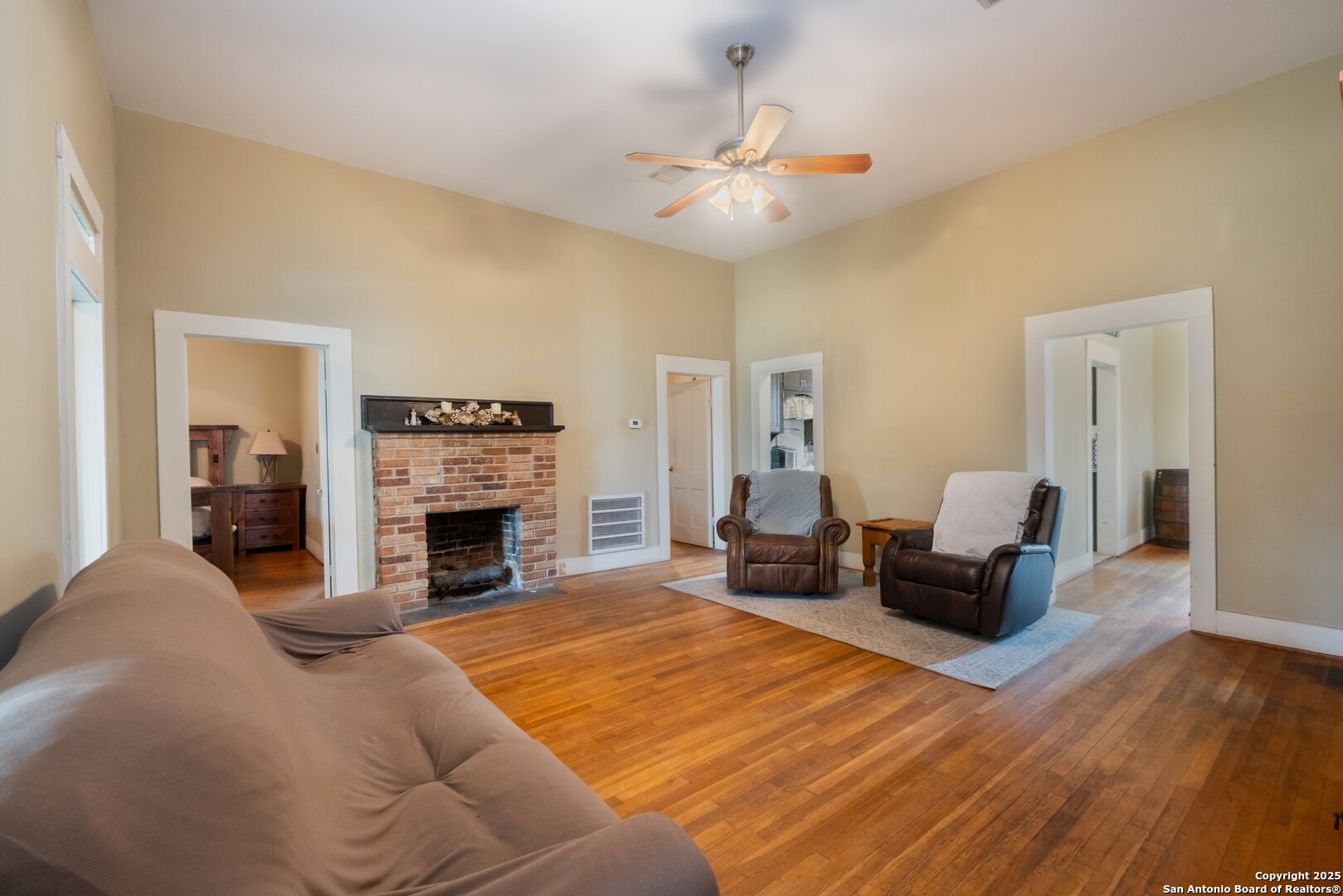 301 Jefferson Drive Devine, TX 78016 - Photo 8 of 29 a living room with furniture and a fireplace