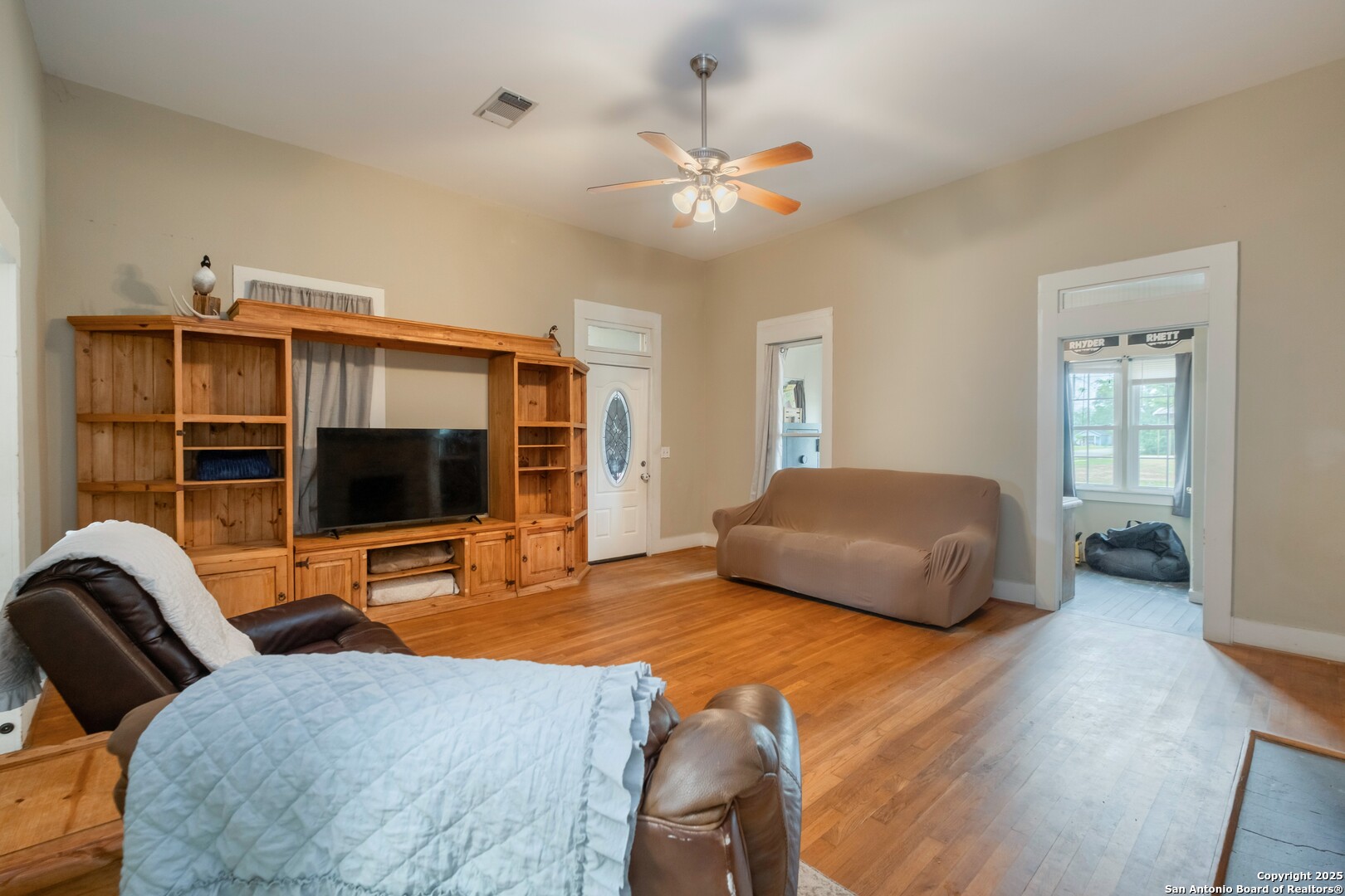 301 Jefferson Drive Devine, TX 78016 - Photo 9 of 29 a bedroom with a bed and a flat screen tv