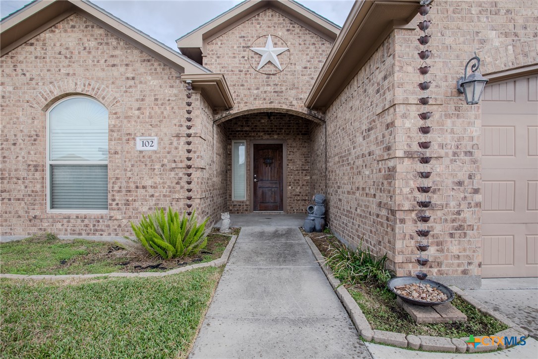 102 Luke Court Victoria, TX 77904 - Photo 2 of 33 a view of a brick house with potted plants