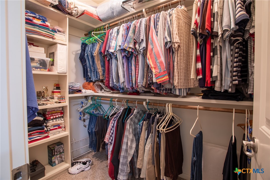 102 Luke Court Victoria, TX 77904 - Photo 21 of 33 a view of walk in closet with clothes and shoes