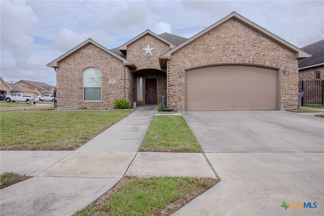 102 Luke Court Victoria, TX 77904 - Photo 33 of 33 a front view of a house with a yard and garage