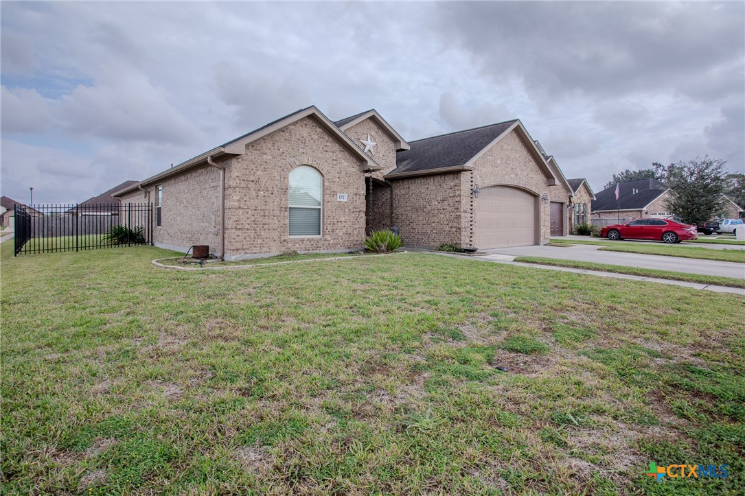 102 Luke Court Victoria, TX 77904 - Photo 4 of 33 a front view of a house with a yard and garage