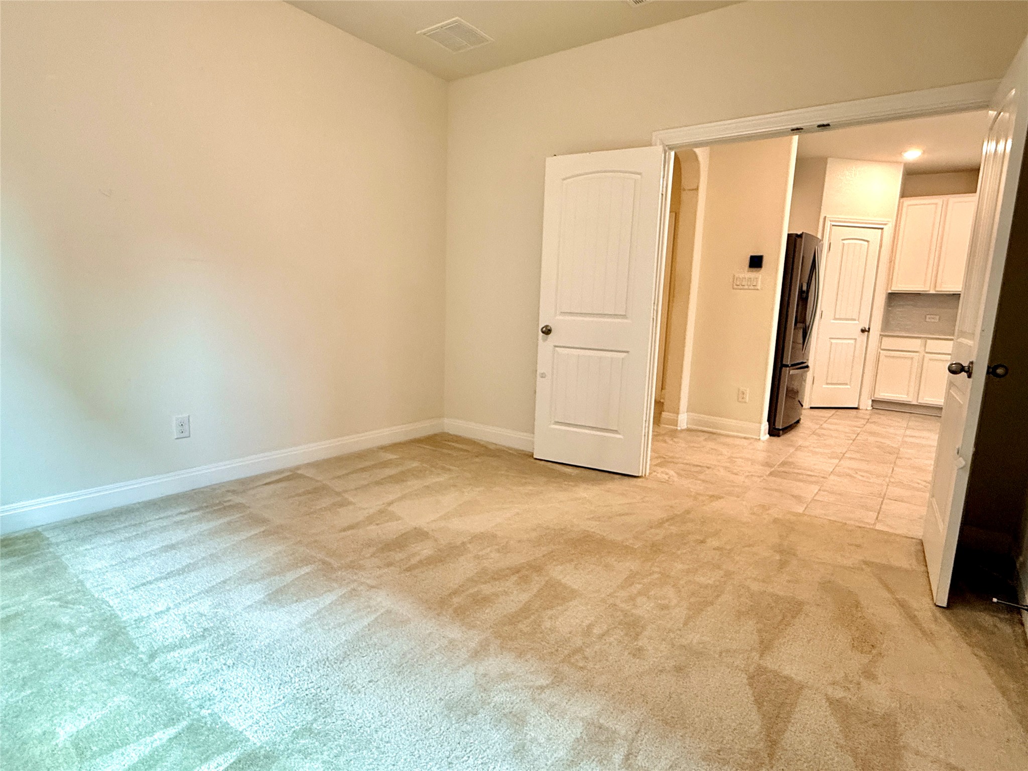 2101 Split Diamond Way, Unit 40 Round Rock, TX 78664 - Photo 9 of 32 A versatile space offering seamless access to the adjacent kitchen, perfect for a home office or guest room.