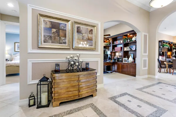 a bed room with furniture and painting on the wall