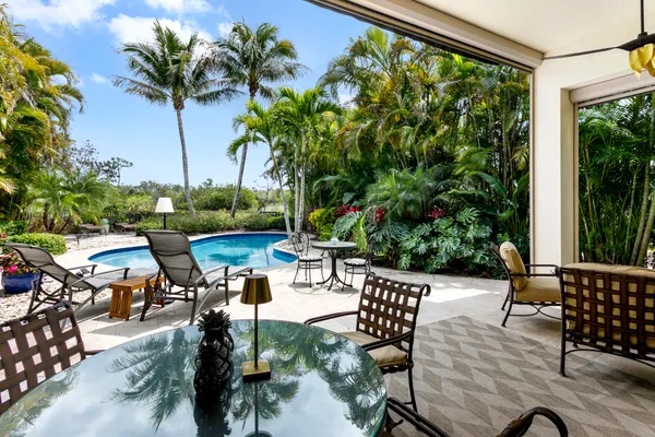 a view of chairs and tables in the patio