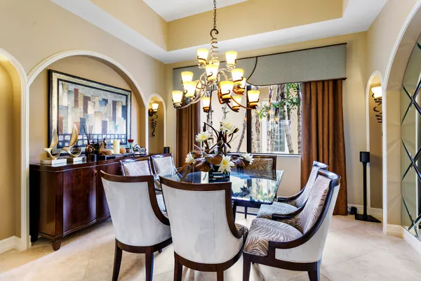 a dining room with furniture and window
